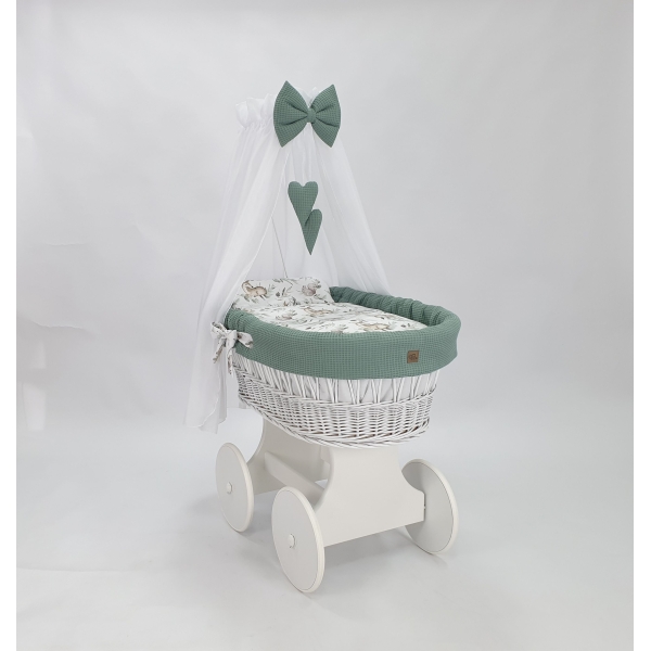 Culla con grange ruote in vimini bianchi