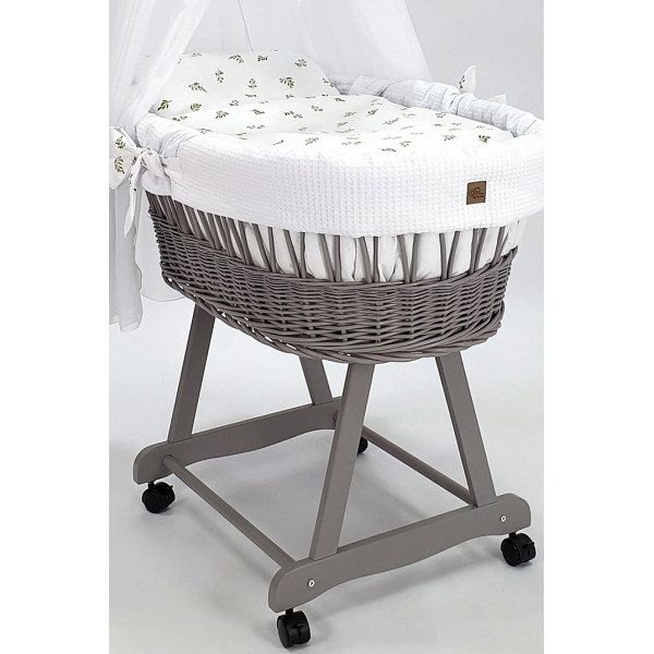 Culla vimini grigio con ruote piroettanti